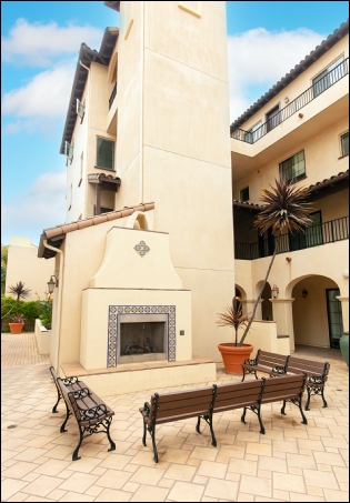 Real Estate Photographer Photo of Outdoor Fireplace and Patio Seating