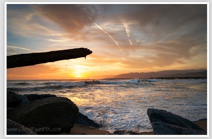 Two Surfers Surfing in Ventura during Sunset