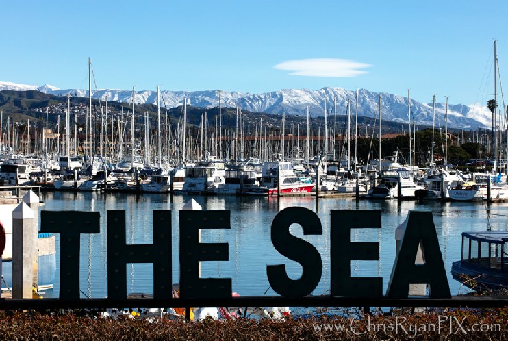 Topa Topa Mountains covered in snow across Ventura Harbor